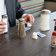 Image for article titled Report: Majority Of Diner’s Salt And Pepper Shakers Currently Being Used To Diagram Elaborately Planned Bank Heists
